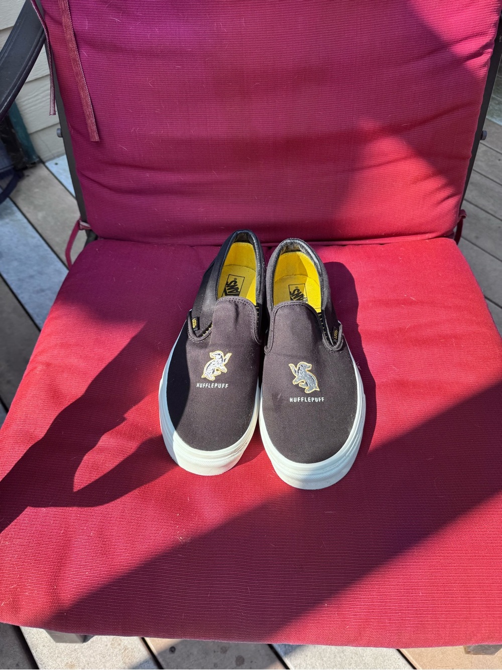 Vans Black Slip-On Sneakers with Yellow Lining and Hufflepuff Detail